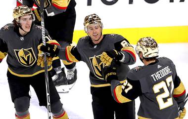 Vegas Golden Knights center Jonathan Marchessault (81) celebrates with left wing Peyton Krebs (18) and defenseman Shea Theodore (27) after scoring the winning goal in overtime against the St. Louis Blues at T-Mobile Arena Friday, May 7, 2021. The Golden Knights beat the Blues 4-3. 