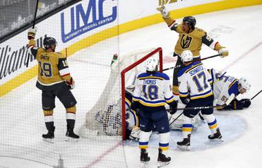 Vegas Golden Knights wing Reilly Smith (19) celebrates with right wing Keegan Kolesar (55) after scoring on St. Louis Blues goaltender Ville Husso (35) in the first period of a game at T-Mobile Arena Saturday, May 8, 2021.