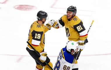 Vegas Golden Knights center Jonathan Marchessault (81) congratulates right wing Reilly Smith (19) after Smith’s hat trick goal in the third period of a game against the St. Louis Blues at T-Mobile Arena Saturday, May 8, 2021. St. Louis Blues left wing Mike Hoffman (68 )is at bottom center