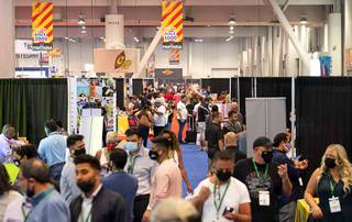 Attendees are shown during the Tobacco Plus Expo (TPE21) at the Las Vegas Convention Center Wednesday, May 12, 2021. The convention, the first at the LVCC since the COVID-19 shutdown, is expected to attract 350 exhibitors and 4,500 attendees.
