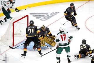 A puck shot by Minnesota Wild center Joel Eriksson Ek (not pictured) gets past Vegas Golden Knights goaltender Marc-Andre Fleury (29) in overtime in Game 1 of a playoff series  at T-Mobile Arena Sunday, May 16, 2021. 