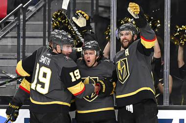 Vegas Golden Knights right wing Reilly Smith (19), center Jonathan Marchessault (81) and defenseman Alex Pietrangelo (7) celebrate Marchessault’s goal during the second period of Game 2 of the team’s first-round NHL hockey playoff series against the Minnesota Wild on Tuesday, May 18, 2021, in Las Vegas.