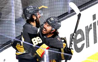 Vegas Golden Knights right wing Alex Tuch (89) celebrates with center Chandler Stephenson (20) after scoring during the third period in Game 2 of a Stanley Cup playoff series against the Minnesota Wild at T-Mobile Arena Tuesday, May 18, 2021. The Golden Knights beat the Wild 3-1. 