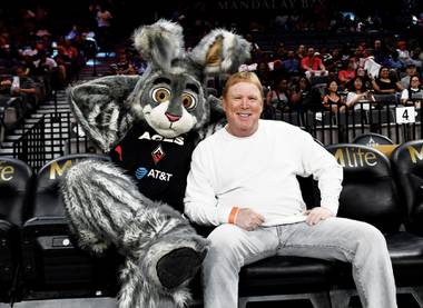 Mark Davis is joined by Buckets, the Las Vegas Aces mascot, at a game in 2019.