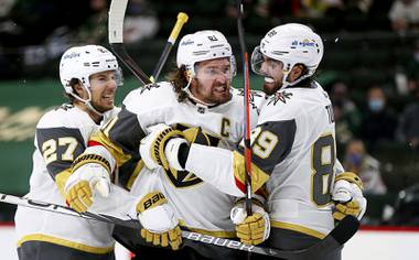 Vegas Golden Knights’ Mark Stone (61) celebrates with teammates after scoring a goal against the Minnesota Wild during the second period in Game 3 of an NHL playoff series Thursday, May 20, 2021, in St. Paul, Minn.