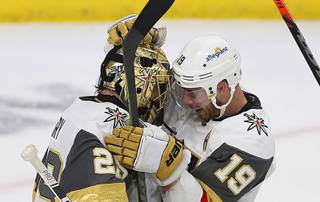 Vegas Golden Knights' goalie Marc-Andre Fleury (29) celebrates with Reilly Smith (19) after the Golden Knights' 5-2 win against the Minnesota Wild in Game 3 of a first-round NHL hockey playoff series Thursday, May 20, 2021, in St. Paul, Minn.