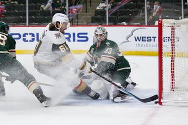 Vegas Golden Knights right wing Mark Stone (61) scores a goal against Minnesota Wild goaltender Cam Talbot (33) in the second period of an NHL hockey game, Saturday, May 22, 2021, in St. Paul, Minn. (AP Photo/Andy Clayton-King)