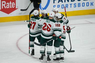 The Minnesota Wild celebrate after scoring against the Golden Knights in the first period of Game 5 of the NHL hockey Stanley Cup first-round playoff series at T-Mobile Arena, Monday May 24, 2021. 