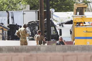 Investigators work the scene of a plane crash that killed a pilot in North Las Vegas, Monday, May 24, 2021.  (Las Vegas Sun/Wade Vandervort)