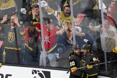 Vegas Golden Knights left wing Max Pacioretty (67) and Vegas Golden Knights center Chandler Stephenson (20) celebrate after Pacioretty scores during the second period of Game 7 of an NHL hockey Stanley Cup first-round playoff series against the Minnesota Wild at T-Mobile Arena Friday, May 28, 2021.