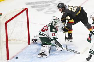 Vegas Golden Knights center Mattias Janmark (26) scores against Minnesota Wild goaltender Cam Talbot (33) during the first period of Game 7 of an NHL hockey Stanley Cup first-round playoff series at T-Mobile Arena Friday, May 28, 2021.