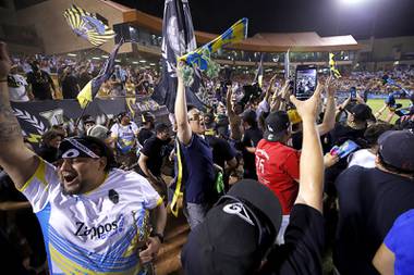 Las Vegas Lights fans celebrate as time runs out for the Tacoma Defiance during the Lights FC home opener at Cashman Field Saturday June 5, 2021. The Lights shut out the Defiance 2-0.