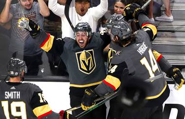 Vegas Golden Knights center Jonathan Marchessault, center, celebrates after his hat-trick goal during the third period in Game 4 of an NHL hockey Stanley Cup second-round playoff series against the Colorado Avalanche at T-Mobile Arena Sunday, June 6, 2021. The Golden Knights beat the Avalanche 5-1. 