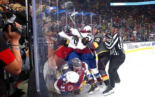 Officials try to break up a fight between the Vegas Golden Knights and he Colorado Avalanche during the second period in Game 4 of an NHL hockey Stanley Cup second-round playoff series at T-Mobile Arena Sunday, June 6, 2021.