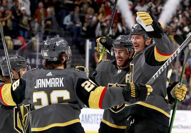 Vegas Golden Knights defenseman Nick Holden, right, celebrates with teammates after scoring during the first period in Game 6 of an NHL hockey Stanley Cup second-round playoff series against the Colorado Avalanche at T-Mobile Arena Thursday, June 10, 2021. 