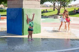 2-year-old Alyza Verdugo plays at a splash pad at Mission Hills Park in Henderson, Monday June 14, 2021. An excessive heat wave warning has been issued for Las Vegas through Saturday June 19th.