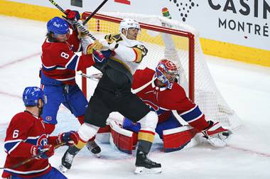 Vegas Golden Knights’ Max Pacioretty is taken out by Montreal Canadiens defenseman Ben Chiarot as goaltender Carey Price snags the puck during the first period of Game 4 in an NHL Stanley Cup playoff hockey semifinal in Montreal, Sunday, June 20, 2021. (Paul Chiasson/The Canadian Press via AP)
