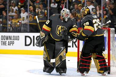 Vegas Golden Knights goaltender Robin Lehner (90) and Marc-Andre Fleury (29) talk during warmups before Game 5 in an NHL Stanley Cup playoff hockey semifinal at T-Mobile Arena Tuesday, June 22, 2021. 