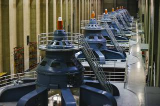 Hydraulic turbines generate power for Arizona at Hoover Dam Tuesday, June 15, 2021.