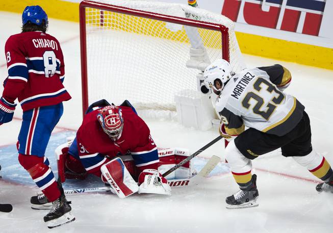 Vegas Golden Knights' Alec Martinez (23) scores on Montreal Canadiens goaltender Carey Price (31) as Canadiens' Ben Chiarot (8) looks on during the third period in Game 6 of an NHL hockey Stanley Cup semifinal playoff series Thursday, June 24, 2021 in Montreal. (Ryan Remiorz/The Canadian Press via AP)