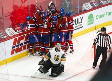 Vegas Golden Knights’ Robin Lehner (90) kneels on the ice as Montreal Canadiens’ Artturi Lehkonen (62) gets mobbed by teammates in celebration of his game-winning goal following overtime in Game 6 of an NHL hockey Stanley Cup semifinal playoff series Thursday, June 24, 2021 in Montreal. (Paul Chiasson/The Canadian Press via AP)