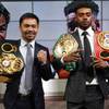 Manny Pacquiao, left, and Errol Spence Jr. pose for a photo at a news conference Sunday, July 11, 2021, at the Fox Studios lot in Los Angeles ahead of their upcoming boxing match, taking place in Las Vegas on Aug. 21. 