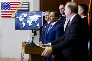 A screen illustrates the span of a global joint investigation called Operation Money Maker during a news conference at the FBI Las Vegas field office Wednesday, July 14, 2021.