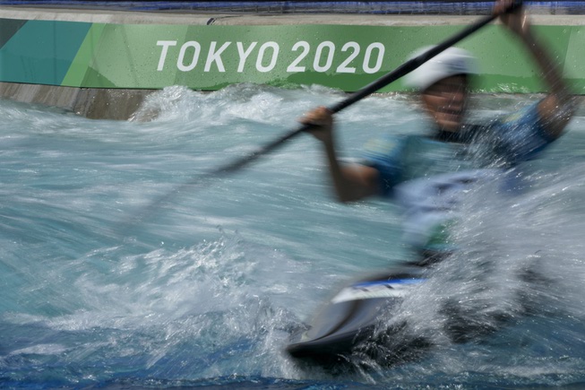 An athlete trains for the men's kayak slalom at Kasai ...