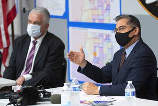 U.S. Department of Health and Human Services (HHS) Secretary Xavier Becerra speaks following a briefing from officials at the Clark County Fire Department Training Facility Thursday, July 22, 2021. Nevada Governor Steve Sisolak listens at left.