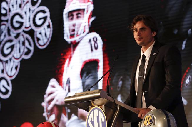 Georgia's JT Daniels speaks to reporters during the NCAA college football Southeastern Conference Media Days Tuesday, July 20, 2021, in Hoover, Ala.