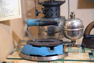 A Coleman self-heating clothes iron, powered by gasoline or kerosene, is displayed at an Obsolete Objects exhibit at the Clark County Museum in Henderson Tuesday, July 27, 2021. The museum will host a free opening reception for the exhibit from 5 p.m. to 7 p.m. on Friday, August 6.
