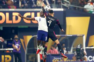 United States forward Gyadi Zardes (9) and Mexico defender Edson Alvarez (4) jump for a header during the first period of the 2021 Concacaf Gold Cup Final at Allegiant Stadium Sunday, Aug. 1, 2021.