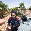 Nikki Kahalehili, a service technician with Goettl Air Conditioning and Plumbing, works on an air conditioner on the roof of a two-story home during a service call Thursday Aug. 5, 2021.