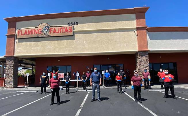 Employees of Juan's Flaming Fajitas are shown outside the location at 9640 W. Tropicana Ave.