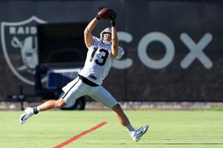 Las Vegas Raiders wide receiver Hunter Renfrow (13) pulls in a pass during the Raiders Training Camp at the Intermountain Healthcare Performance Center in Henderson Friday, Aug. 6, 2021. STEVE MARCUS