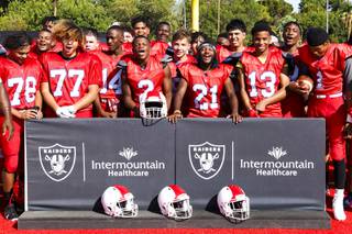 The Valley High School football team chants Go Raiders after hearing that the Raiders will be donating new helmets to their team Monday, Aug. 9, 2021. The Raiders will be donating two new sets of helmet that have been specifically designed for the school.