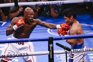 Yordenis Ugás lands a punch on Manny Pacquiao during their WBA World Welterweight Championship bout at T-Mobile Arena Saturday, Aug. 21, 2021.