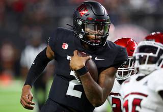 UNLV Rebels quarterback Doug Brumfield (2) makes a touchdown run in double overtime during the second half of an NCAA college football game against the Eastern Washington Eagles at Allegiant Stadium Thursday, Sept. 2, 2021, in Las Vegas.