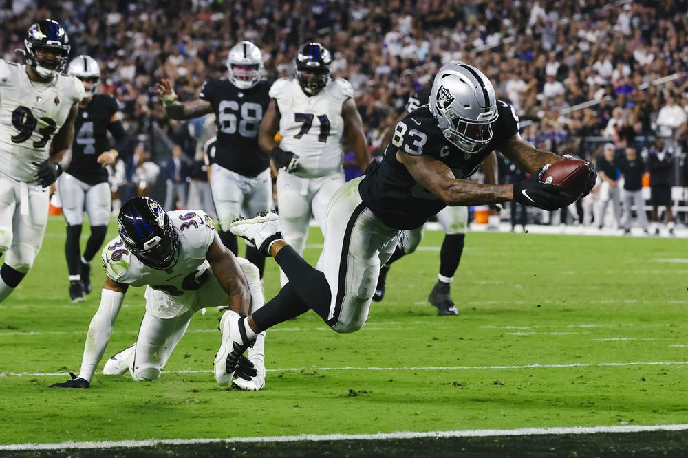 Las Vegas Raiders tight end Darren Waller (83) is tackled by