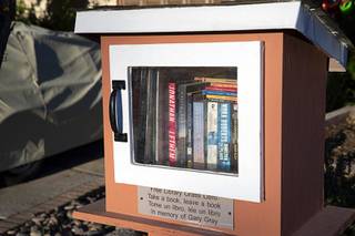 A little free library is shown in front of Chris Giunchiglianis home Thursday, Sept. 16, 2021. The library is dedicated to the memory of her late husband Gary Gray.