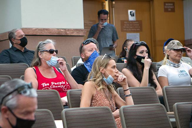People flout an indoor mask mandate during a commission meeting at the Clark County Government Center Tuesday, Sept. 21, 2021.