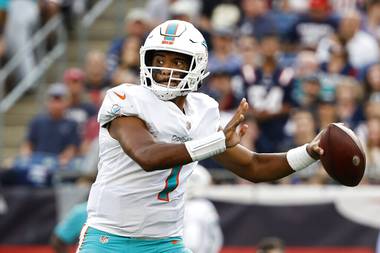 In this Sunday, Sept. 12, 2021 file photo, Miami Dolphins quarterback Tua Tagovailoa passes against the New England Patriots during the first half of an NFL football game in Foxborough, Mass. Quarterback Tua Tagovailoa has fractured ribs and won’t play Sunday, Sept. 26, 2021 when the Dolphins visit the Raiders. 