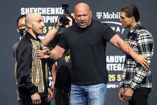 UFC President Dana White keeps UFC featherweight champion Alexander Volkanovski, left, and challenger Brian Ortega apart during a UFC 266 news conference at Park Theater Thursday, Sept. 23, 2021. UFC 266 takes place Saturday at T-Mobile Arena.