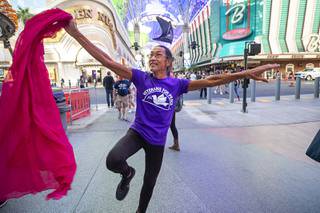 Peace dancer Sharat G. Lin performs during a street theater protest at the Fremont Street Experience in downtown Las Vegas Thursday, Sept. 30, 2021. Members of Veterans for Peace, CODEPINK, and Gamers For Peace, participated in the protest against U.S. military drone strikes. STEVE MARCUS