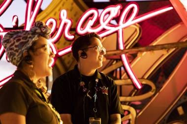 Marimar Rivera and Johann Rucker strolled along the twisting dirt path of the Neon Museum’s Boneyard, faces illuminated by glowing signs of Las Vegas past. Speaking in Spanish, they outlined the signs’ history, construction and preservation. 

