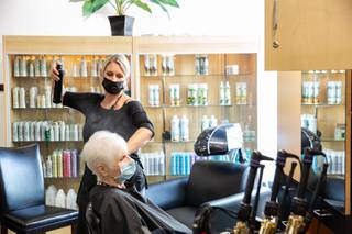 Stylist Julie Dicillo, of Modern Image LV, works on a client at the Body Spa West Salon Friday Sept. 24, 2021.