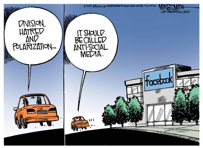 Two persons in car driving past Facebook headquarters.  One says, 