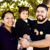 Ronal Portillo poses for a photo with his wife Marisela Duran-Cerro and their 2-year old daughter Arlette outside their home Wednesday, Oct. 13, 2021.  Portillo, who was laid off in March 2020 from his buffet cook position at Fiesta Rancho casino, has since struggled to find work and make ends meet. YASMINA CHAVEZ