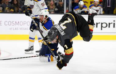 Vegas Golden Knights defenseman Alex Pietrangelo (7) gets tripped up by St. Louis Blues defenseman Justin Faulk (72) during the third period of an NHL hockey game at T-Mobile Arena Wednesday, Oct. 20, 2021.