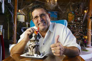 Owner Sergio Perez poses for a photo with a Cookies & Cream Ice Cream Milkshake at Havana Grill's bakery Tuesday, Oct. 19, 2021.